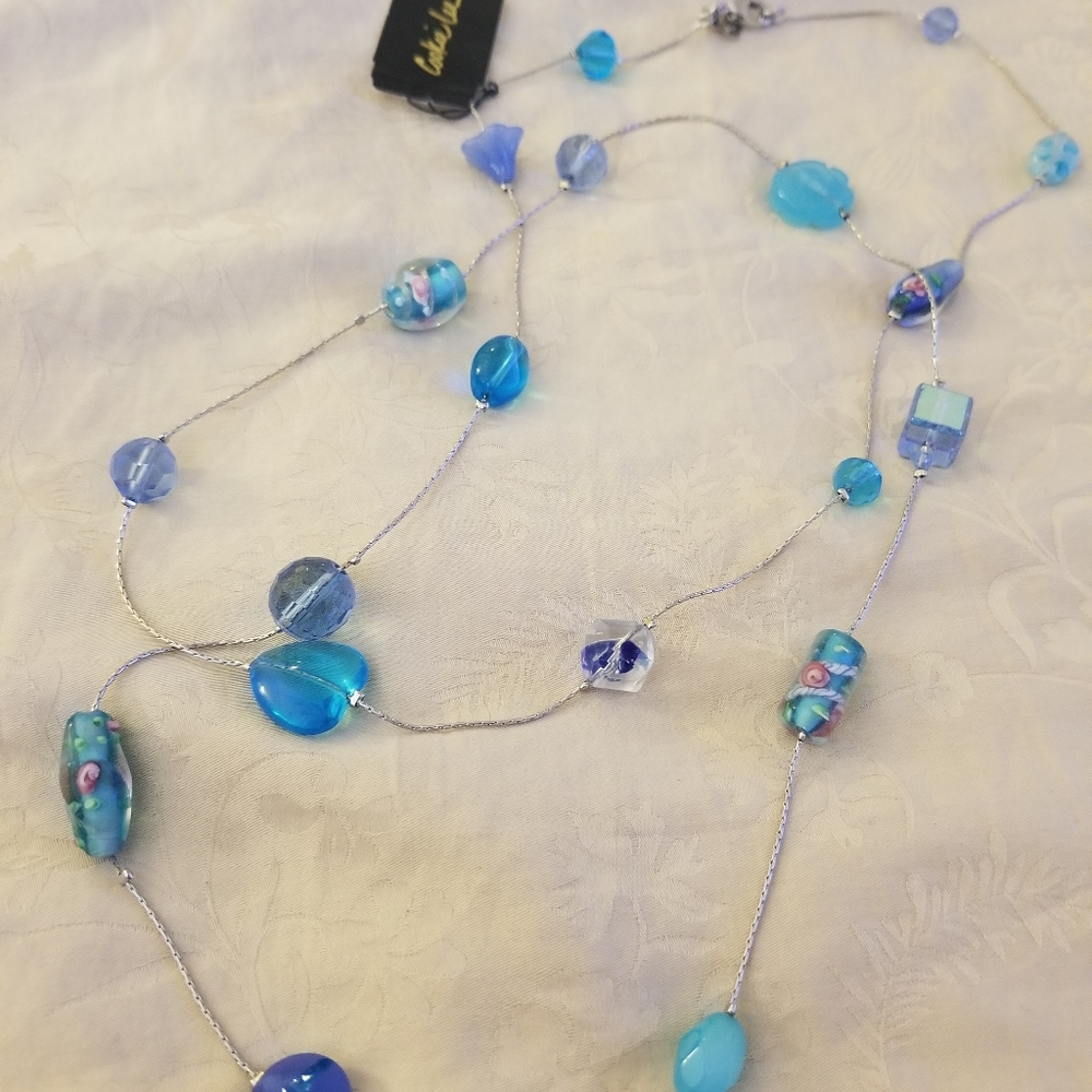 Brand New long silver with genuine crystals of blue hues necklace